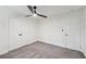 Neutrally carpeted bedroom with closet, ceiling fan, and ample natural light at 4363 Old Mabry Road Northeast Ne Rd, Roswell, GA 30075