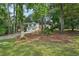 Charming two-story home with white siding, a two-car garage, and a beautiful front lawn at 4363 Old Mabry Road Northeast Ne Rd, Roswell, GA 30075