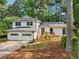 Charming two-story home with white siding, a two-car garage, and a wooden porch at 4363 Old Mabry Road Northeast Ne Rd, Roswell, GA 30075