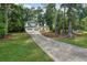 Charming two-story home with white siding, a two-car garage, and a long driveway at 4363 Old Mabry Road Northeast Ne Rd, Roswell, GA 30075