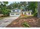 Charming two-story home with white siding, a two-car garage, and a spacious front yard at 4363 Old Mabry Road Northeast Ne Rd, Roswell, GA 30075