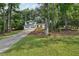 Charming two-story home with white siding, a two-car garage, and a luscious lawn at 4363 Old Mabry Road Northeast Ne Rd, Roswell, GA 30075
