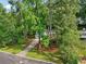 A cozy home, partially obscured by mature trees, with a driveway leading to a two-car garage at 4363 Old Mabry Road Northeast Ne Rd, Roswell, GA 30075