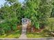 Charming home surrounded by mature trees, featuring a well-manicured lawn and a two-car garage at 4363 Old Mabry Road Northeast Ne Rd, Roswell, GA 30075