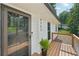 Close up of a charming front porch with wooden deck and white siding at 4363 Old Mabry Road Northeast Ne Rd, Roswell, GA 30075