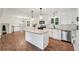 Stylish kitchen features an island, granite countertops, stainless steel appliances, and ample white cabinetry at 4363 Old Mabry Road Northeast Ne Rd, Roswell, GA 30075