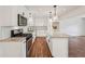 Beautiful kitchen with stainless appliances, granite countertops and island open to additional living space at 4363 Old Mabry Road Northeast Ne Rd, Roswell, GA 30075