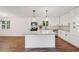 Modern kitchen featuring white cabinets, granite countertops, a center island and stainless steel appliances at 4363 Old Mabry Road Northeast Ne Rd, Roswell, GA 30075