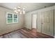 Bright room with hardwood floors, a closet, and a window with a view of the outdoors at 4363 Old Mabry Road Northeast Ne Rd, Roswell, GA 30075