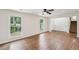 Bright living room featuring hardwood floors, large windows, and a view into the landscaped yard at 4363 Old Mabry Road Northeast Ne Rd, Roswell, GA 30075