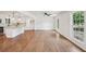 Open concept kitchen and living room with hardwood floors and white cabinets at 4363 Old Mabry Road Northeast Ne Rd, Roswell, GA 30075