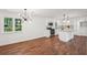 Spacious living room boasting gleaming hardwood floors leading to a modern kitchen at 4363 Old Mabry Road Northeast Ne Rd, Roswell, GA 30075