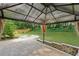 Patio featuring a pergola, brick pavers, rock fire pit and yard at 4363 Old Mabry Road Northeast Ne Rd, Roswell, GA 30075