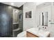 Contemporary bathroom with glass-enclosed shower, sleek vanity, and stylish tile accents at 943 Peachtree Ne St # 902, Atlanta, GA 30309