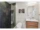 Modern bathroom featuring herringbone tile, a glass shower, and sleek vanity at 943 Peachtree Ne St # 902, Atlanta, GA 30309