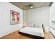 Cozy bedroom offers ample natural light and a modern ceiling fan at 943 Peachtree Ne St # 902, Atlanta, GA 30309