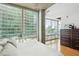 Bedroom with windows that have green blinds and nice hardwood floors at 943 Peachtree Ne St # 902, Atlanta, GA 30309