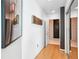 Hallway with hardwood floors, nice artwork, and sliding mirror closet doors at 943 Peachtree Ne St # 902, Atlanta, GA 30309