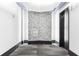 Hallway outside of the elevator with hardwood floors and interesting decorations at 943 Peachtree Ne St # 902, Atlanta, GA 30309