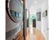 Hallway with hardwood floors and a modern washer and dryer at 943 Peachtree Ne St # 902, Atlanta, GA 30309