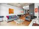 Comfortable living room with a gray sofa, modern coffee table, hardwood floors, and natural light at 943 Peachtree Ne St # 902, Atlanta, GA 30309