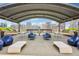 Spacious rooftop deck with grilling stations, dining tables, and comfortable lounge seating at 943 Peachtree Ne St # 902, Atlanta, GA 30309