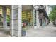 Street view showcasing the building's exterior with commercial tenants and well-maintained sidewalks at 943 Peachtree Ne St # 902, Atlanta, GA 30309