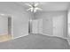 Expansive bedroom featuring lots of space, three doors, and neutral carpeting at 3044 Lauren Parc Rd, Decatur, GA 30032