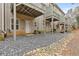 Exterior view features gravel yard, multiple decks, and neutral siding at 3044 Lauren Parc Rd, Decatur, GA 30032
