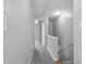 Bright upstairs hallway with neutral carpet leading to bedrooms, and a stairway at 3044 Lauren Parc Rd, Decatur, GA 30032
