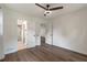 Bedroom features hardwood floors, ceiling fan, ensuite bathroom, and large closet space at 3480 Tanbark Ne Ct, Brookhaven, GA 30319