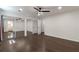 A spacious bedroom showcasing a mirrored closet, hardwood floors and a modern ceiling fan at 3480 Tanbark Ne Ct, Brookhaven, GA 30319