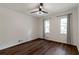 Bedroom features hardwood floors, ceiling fan, neutral paint and two windows with lovely trim at 3480 Tanbark Ne Ct, Brookhaven, GA 30319