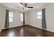 Inviting bedroom with hardwood floors, ceiling fan, and plenty of natural light through the windows at 3480 Tanbark Ne Ct, Brookhaven, GA 30319