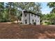Rear exterior of the home displaying well-maintained landscaping and charming backyard at 3480 Tanbark Ne Ct, Brookhaven, GA 30319