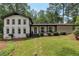 Charming two-story home featuring a welcoming front yard, black accents, and well-maintained landscaping at 3480 Tanbark Ne Ct, Brookhaven, GA 30319