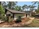 Charming home exterior showcasing a landscaped yard and stone pathway at 3480 Tanbark Ne Ct, Brookhaven, GA 30319