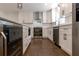 Bright kitchen featuring white cabinets, stainless steel appliances, and hardwood floors at 3480 Tanbark Ne Ct, Brookhaven, GA 30319