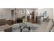 Modern open-concept living room with dark wood flooring, stainless steel appliances and stairs to the second floor at 3480 Tanbark Ne Ct, Brookhaven, GA 30319