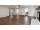 Bright living room features hardwood floors, ceiling fan, and access to laundry and bathroom at 3480 Tanbark Ne Ct, Brookhaven, GA 30319