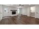 Bright living room with a fireplace, hardwood flooring, a ceiling fan, and ample natural light at 3480 Tanbark Ne Ct, Brookhaven, GA 30319