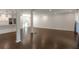 Bright and open living space featuring wood flooring, modern lighting, and access to the kitchen at 3480 Tanbark Ne Ct, Brookhaven, GA 30319