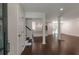 Spacious living area with wood floors, an open floor plan, and easy access to the modern kitchen at 3480 Tanbark Ne Ct, Brookhaven, GA 30319