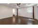 Bright, airy bedroom with hardwood floors, large window, and access to the ensuite bathroom at 3480 Tanbark Ne Ct, Brookhaven, GA 30319