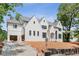 Elegant white brick home with black windows and a three-car garage at 3118 Lanier Ne Dr, Brookhaven, GA 30319