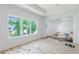 Bright living room with hardwood floors being installed and multiple windows at 3118 Lanier Ne Dr, Brookhaven, GA 30319