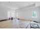 Bright living room featuring hardwood floors being installed and large windows at 3118 Lanier Ne Dr, Brookhaven, GA 30319