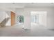 Spacious living area with sleek door frames and staircase at 3118 Lanier Ne Dr, Brookhaven, GA 30319