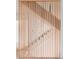 Contemporary staircase design with wooden slat partition at 3118 Lanier Ne Dr, Brookhaven, GA 30319