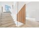Modern staircase with a distinctive wood slat wall feature at 3118 Lanier Ne Dr, Brookhaven, GA 30319
